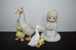 Two Goose Figures and a Girl