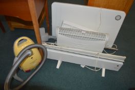 Four Electric Heaters and a Vacuum Cleaner