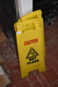 *Four Caution Wet Floor Signs