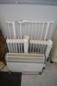 Three Electric Heaters and a Child Gate