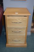 Light Oak Three Drawer Bedside Cabinet