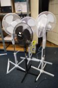 *Four White and One Black Pedestal Fans