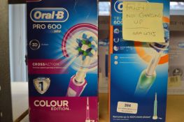 *Two Oral-B Electric Toothbrushes