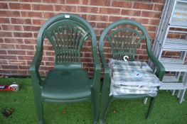 Three Green Plastic Stackable Garden Chairs with C
