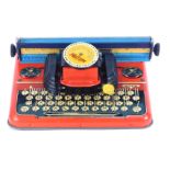 A Mettype Junior tin plate typewriter, no. 4315, boxed.