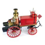 A steel and brass steam model of a Victorian horse drawn fire engine, 57cm long.