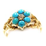 A Victorian turquoise and old cut diamond flower head ring, set in a scrolling yellow metal shank, s