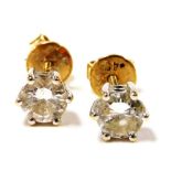 A pair of 18ct gold and diamond ear studs, high claw set, each approx 0.5cts, 2.1g.