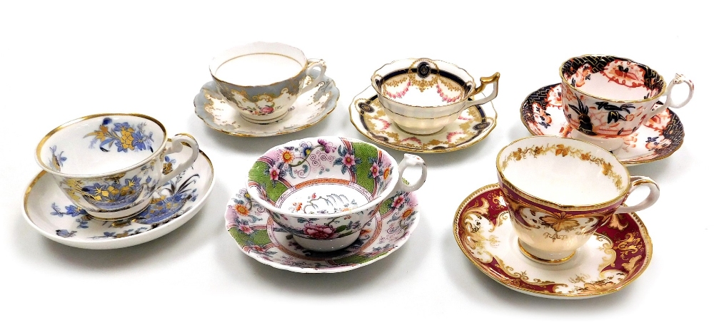 A group of six early 19thC Ridgway porcelain teacups and saucers, various decorated, including patte