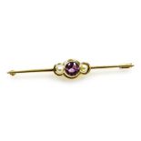 An Edwardian amethyst and seed pearl bar brooch, set in yellow metal, stamped 585, 3.2g.