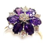 An amethyst and diamond flower head ring, high claw set in white metal, diamonds approx 0.5ct, size