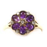 A 9ct gold, amethyst and diamond flower head ring, in a six petal design, interspersed with diamonds