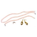 A pink freshwater pearl parure, set with large and small pearl at intervals, comprising a necklace,