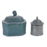 A late 18th/early 19thC lead tobacco box, with head shaped finial and a pewter tobacco jar. (2)