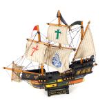 A Santa Maria wooden ship model, on stand, 44cm high, 44cm wide.