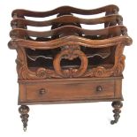 A Victorian rosewood Canterbury, with a foliate scroll three division top, over frieze drawer raised