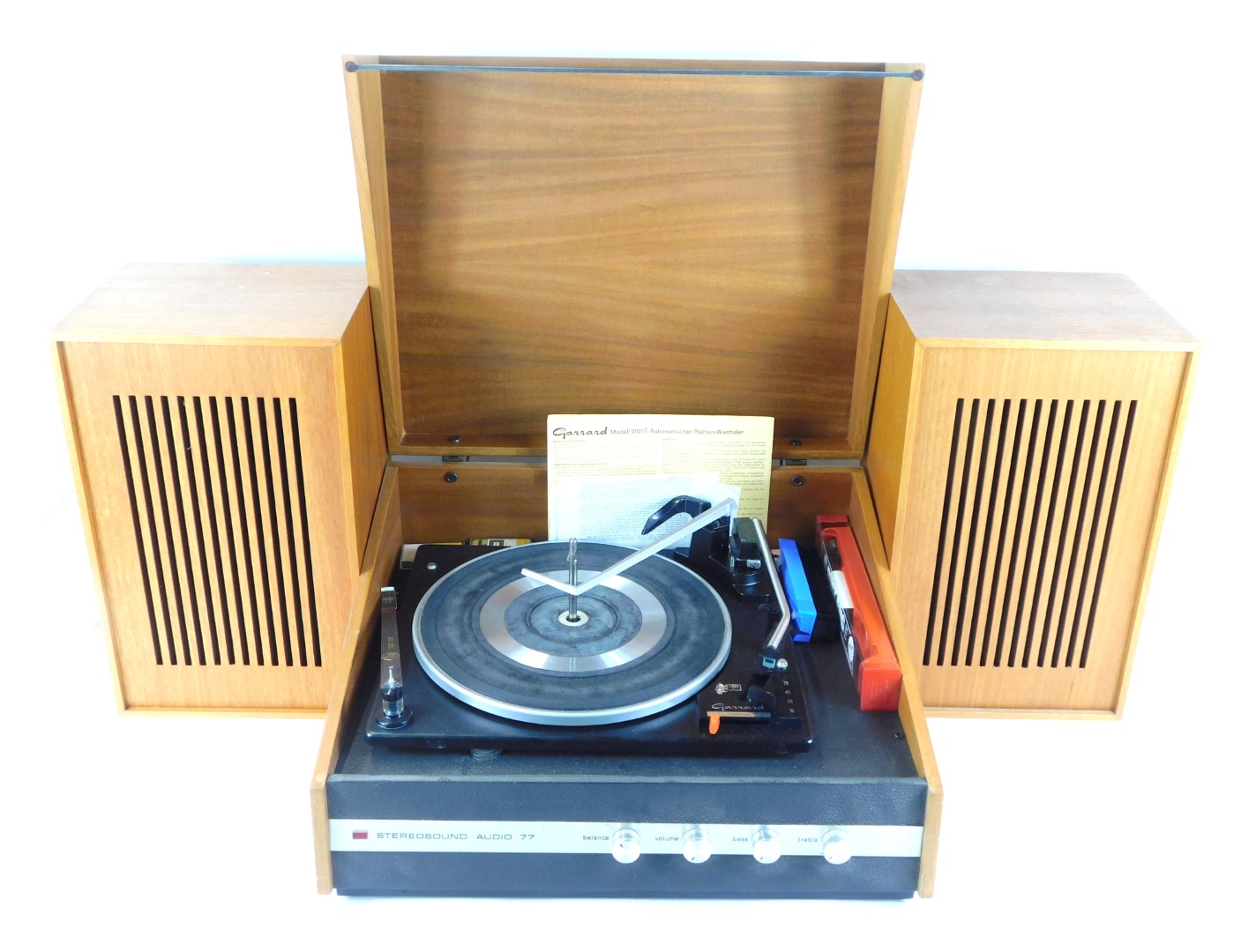 A Garrard automatic turntable, model 2025T, with stereo sound audio 77, and a pair of speakers.