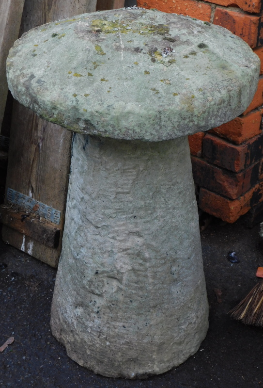 A reconstituted stone staddle stone, 72cm high, 47cm diameter.