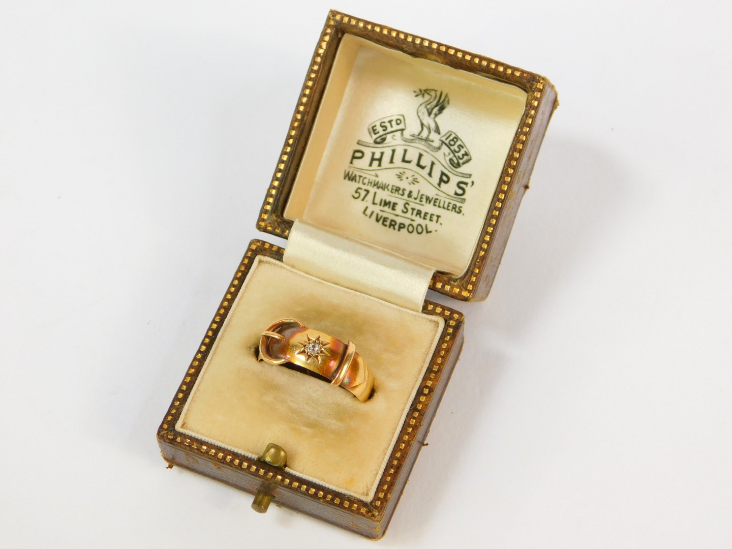 An 18ct gold and diamond solitaire ring, in a belt and buckle design, size O, 3g.