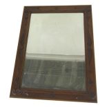 A Victorian oak framed rectangular wall mirror, with a carved floral and scroll border, 108cm x 84cm