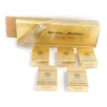 Five packs of Benson and Hedges Special Filter Gold, each enclosing twenty king size cigarettes, sea