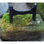 A stone and cast metal boot scraper, 30cm high. (AF)