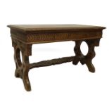 A 19thC Italian walnut centre table, with demi lune carved top, frieze drawers with carved decoratio