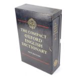 A compact Oxford English dictionary, new edition, in presentation case.