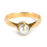 A cultured pearl dress ring, with single cultured pearl in a four claw raised basket setting, with p