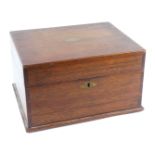 An early 20thC mahogany box, with brass escutcheon plates, of rectangular section, the hinged lid op