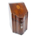 A George III mahogany and satinwood cross banded knife box, of serpentine form, with paterae inlay,