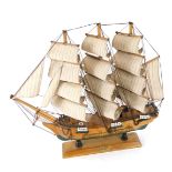 A HMS Bounty wooden ship model, 59cm high, 50cm wide.