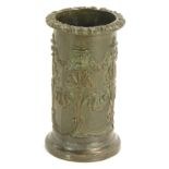 A 19thC bronze spill vase, of cylindrical form, with a fluted floral top, embossed with floral swags