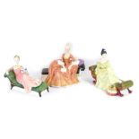 Three Royal Doulton figures, comprising Reverie, HN2306, Repose, HN2272, and At Ease, HN2473.
