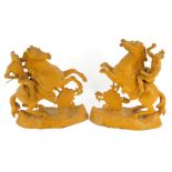 A pair of late 19thC painted spelter figures, modelled as soldiers in armour on rearing horses, supp