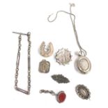 A group of Victorian silver jewellery, comprising bar brooches, lockets, and watch chains, a horsesh