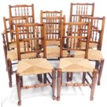 A set of eight 18thC elm spindle back dining chairs, including two carvers, with rush seats. (8)