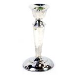 A George V silver taper candlestick, on a reeded column with weighted base, Birmingham, hallmarks ru