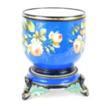 A 19thC Paris porcelain jardiniere, on a royal blue ground with flower decoration on bamboo stepped