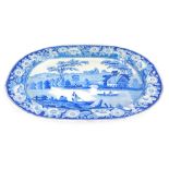 An early 19thC blue and white meat platter, decorated in the Neunham Courtney pattern, 49.5cm wide.