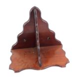 A Victorian mahogany wall bracket, of serpentine form, 37cm high, 44cm wide.