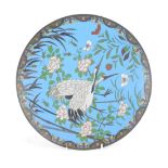 A Meiji period Japanese cloisonne charger, on a blue ground with central storks and flowers, 32cm di