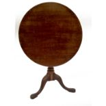 A Georgian mahogany supper table, with circular tilt top over a bird cage, on gun barrel turned pill