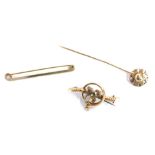 A group of jewellery, comprising a 9ct gold floral scroll topped stick pin, a bar brooch with centra