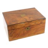 A Victorian walnut sewing box, with brass escutcheons, containing cotton reels, etc., 14.5cm high, 3