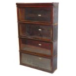 A Globe Wernicke Company Limited mahogany four section bookcase, with a pediment over four glazed up