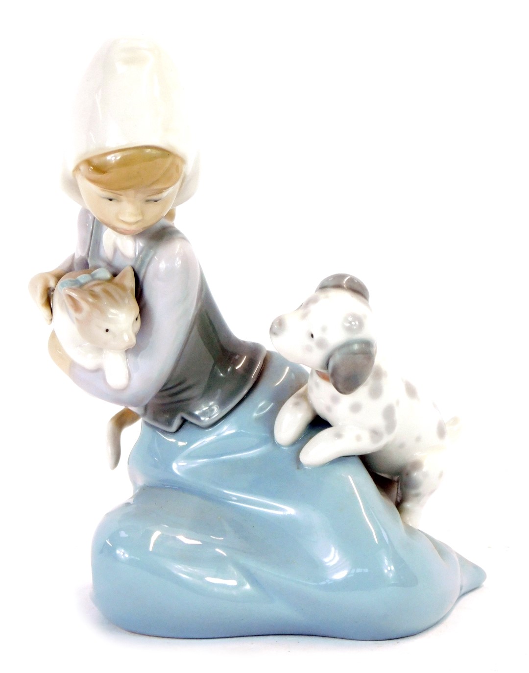 A Lladro porcelain figure of a girl, modelled kneeling with a kitten and a puppy.