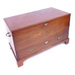 A George III mahogany mule chest, with brass carrying handles, with a hinged lid, the front with dum