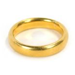 A 22ct gold wedding band, of plain design, ring size N, 8g all in.