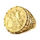 A George V gold full sovereign 1911, in 9ct gold basket weave ring setting, size W, 15.6g all in.